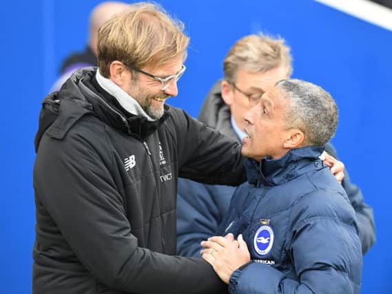 Jurgen Klopp and Chris Hughton pictured at the Amex earlier this season. Picture by Phil Westlake (PW Sporting Photography)