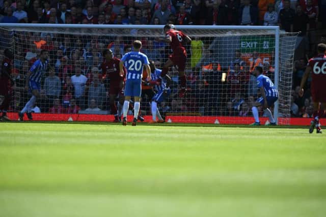 Liverpool v Brighton & Hove Albion. Dejan Lovren powers his header home for the host's second goal. Pictures by PW Sporting Photography