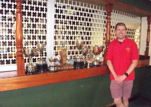 Stuart Carruthers with his huge bar billiards haul of trophies SUS-180513-132611002