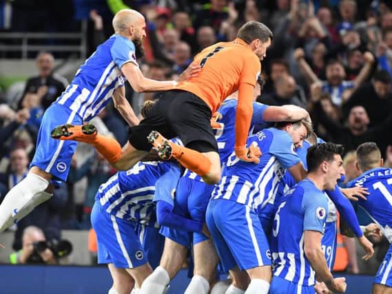 Albion celebrate Pascal Gross's in the win against Manchester United. Picture by Phil Westlake (PW Sporting Photography)