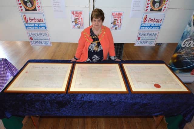 The Mayor of Eastbourne Cllr Pat Hearn with the 1883 'Charter for the Town of Eastbourne' which has been restored and is to go on display at Eastbourne Town Hall. It shown at the recent Art Exhibition held by the Society of Eastbourne Artists at Eastbourne Town Hall. SUS-180514-130254001