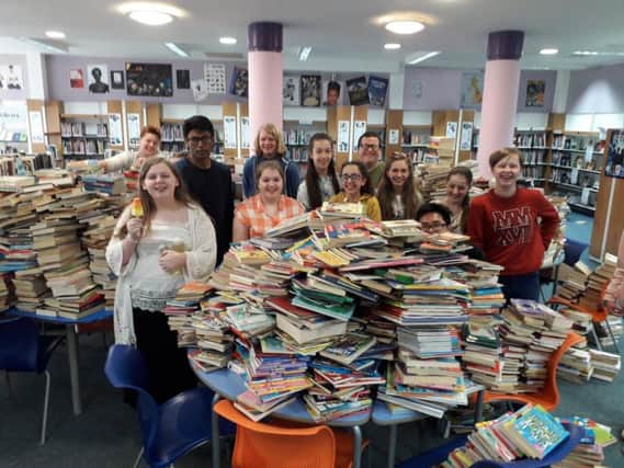Students collected and sorted the books in the school library, once they had been measured in the tutor groups