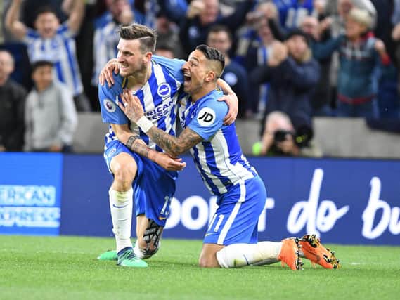 Pascal Gross and Anthony Knockaert celebrate the former's goal in the win against Manchester United. Picture by Phil Westlake (PW Sporting Photography)