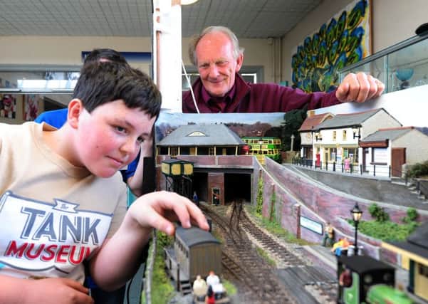 Chris Davis from Bognor Regis Model  Railway Club and Tom Baker Owens 11, with the layout at last year's SWING. Picture: Kate Shemilt ks170883-2