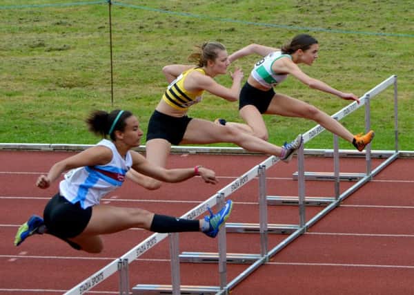 Sophie Dudman (farthest from camera) flies over the hurdles / Picture by Lee Hollyer