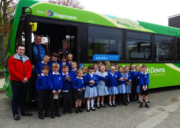 Assistant operations manager Martin McDougall and driver Tim Maynard from Stagecoach, along with staff and pupils from Petworth Primary School