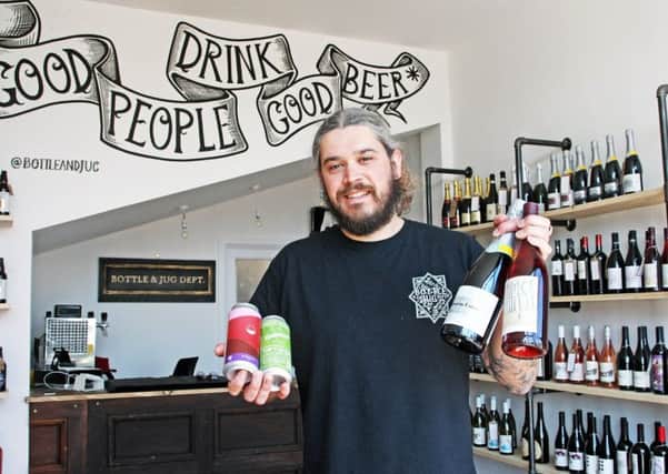 Tom Flint with some of the selection at Bottle & Jug Dept in Worthing DM1851291a