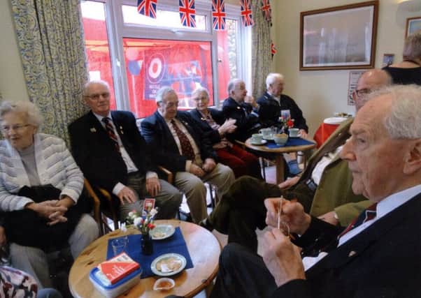 Guests enjoying the RAF 100 cream tea. Right front, from 617 Dambuster squadron and appearances on several TV programmes about the Lancaster, Wing Commander John Bell, opposite him John Francis, long time member and committee member of RAFA, next to him ex-Harrier pilot Wing Commander Bryan Baker AFC.