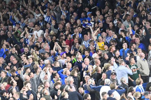 Albion fans celebrate Pascal Gross's goal against Manchester United. Picture by Phil Westlake (PW Sporting Photography)
