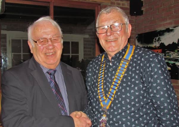 West Worthing Rotary Club president. Jeremy Flaskett, welcomes Ron Noakes to a meeting of the club