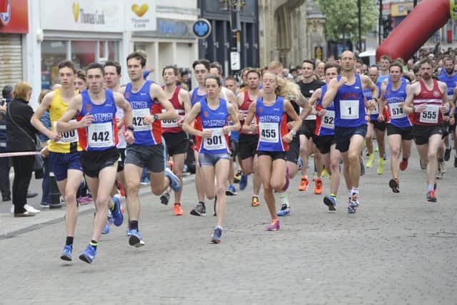 Runners set off at the start of the 2018 Hastings Runners Five-Mile Race with men's winner Gary Foster (race number 442) at the front. Pictures by Simon Newstead