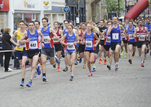 Runners set off at the start of the 2018 Hastings Runners Five-Mile Race with men's winner Gary Foster (race number 442) at the front. Pictures by Simon Newstead