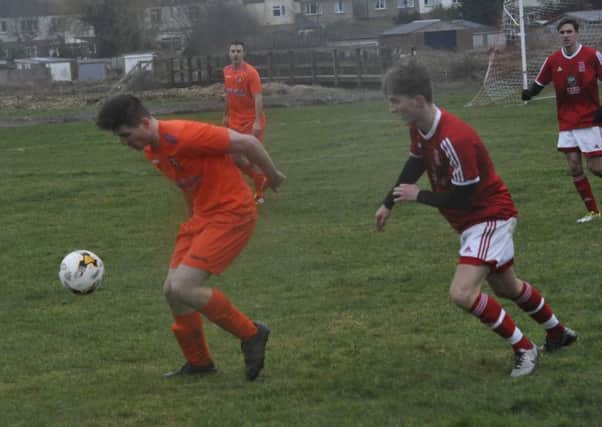 Action from Battle Baptists' match away to Bexhill Town earlier in the year. Picture by Simon Newstead
