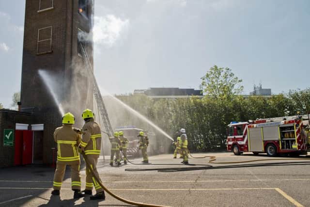 The new firefighters showcase their fire skills at the passing out parade