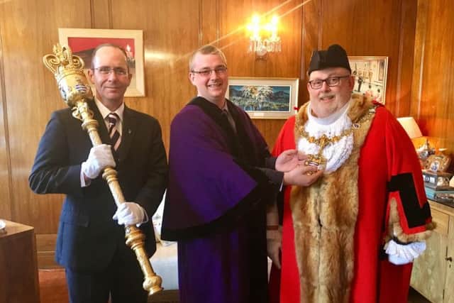 Councillor Alex Harman handing over the mayoralty to councillor Paul Baker at the Worthing Borough Council annual meeting