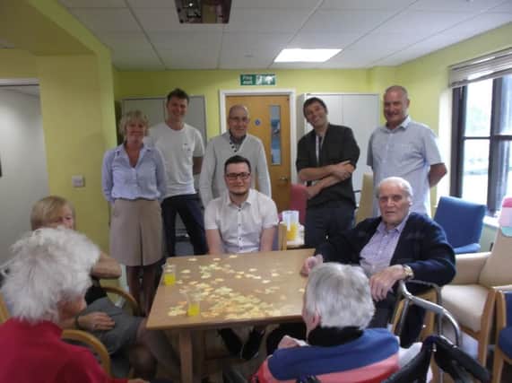 Milton Grange residents with their new magic table SUS-180530-092850001