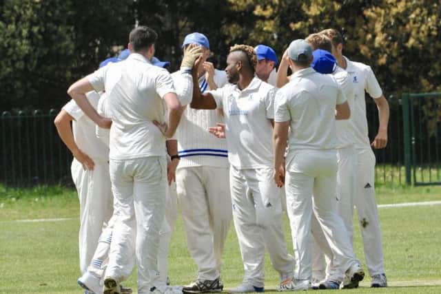 Goring celebrate a wicket in the win over rivals Worthing. Picture by Stephen Goodger