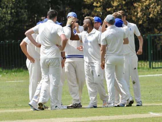 Goring celebrate a wicket in the win over rivals Worthing. Picture by Stephen Goodger