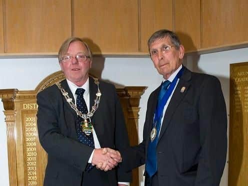 Councillor Alan Gammon shakes hands with vice chairman
councillor Pat Dillon