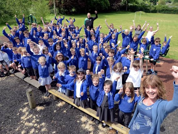 Headteacher Sarah Titley, staff and pupils celebrate their Ofsted report