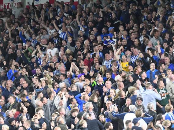Brighton fans celebrate a goal against Manchester United. Picture by PW Sporting Photography