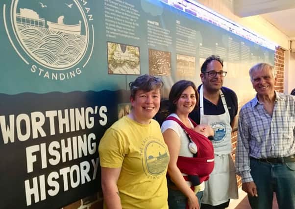 Anne Thwaites, Fran Corney, Andy Sparsis and John Booker in front of the Last Fisherman Standing history wall in The Fish Factory in Brighton Road, Worthing