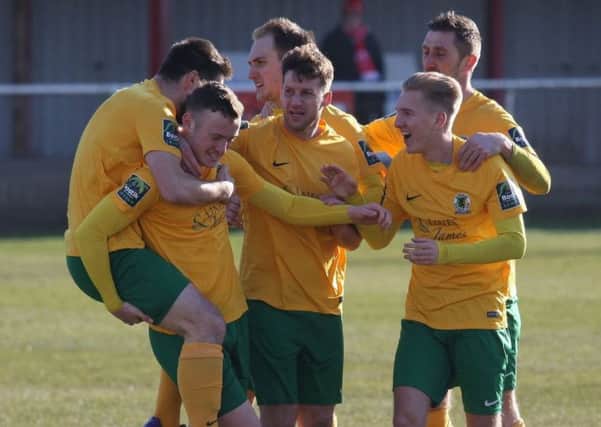 Alfie Rogers is mobbed after giving Horsham an early lead against Hythe Town. Picture by John Lines.