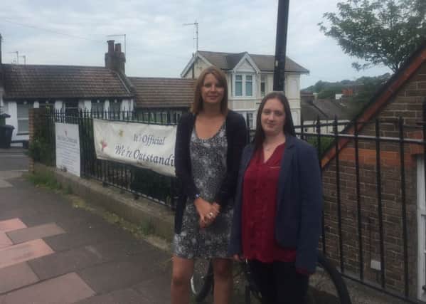 Mum Cat Harris and Little Stars owner/manager Laura Rich by the car club space they would like changed to a loading bay or dedicated drop off point in Riley Road