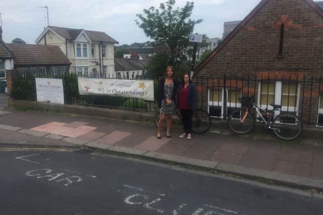 Mum Cat Harris and Little Stars owner/manager Laura Rich by the car club space they would like changed to a loading bay or dedicated drop off point in Riley Road