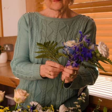 Bridget Westerman creates flower arrangements for patients