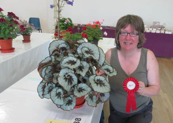 Helen Swyer with her best in show foliage plant at last year's early summer show. Picture: Barry Hillman