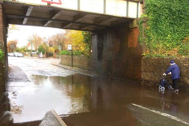 Flooding under the railway bridge could leave residents 'soaked'. Photo: Will Flewett