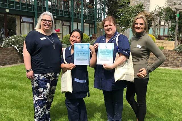 Nurses with their certificates
