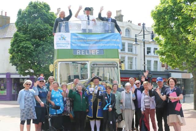 Worthing town crier Bob Smytherman, centre, with Worthing Dementia Action Alliance members, supporters and guests in South Street Square