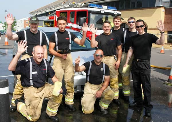 Littlehampton firefighters at Morrisons in Wick for a charity car wash. Picture: Derek Martin DM1853200a