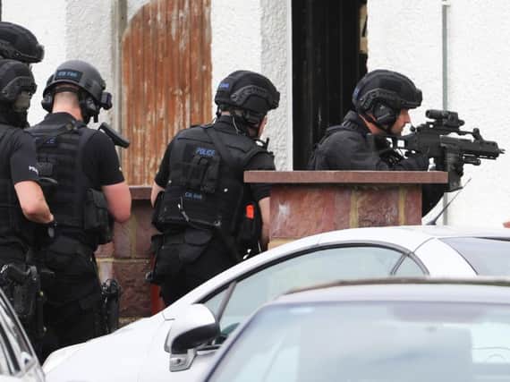 Armed police at the scene (Photograph: Eddie Mitchell)