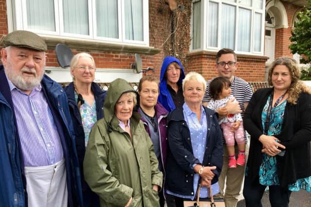 Rodney and Pat Chambers, Anne Kenny, Lucy Birkinshaw, Jane King, 
Angela Smith, Wayne McConnell with his daughter and Yasmin Hassan in South Terrace, Littlehampton, which has been affected by flooding