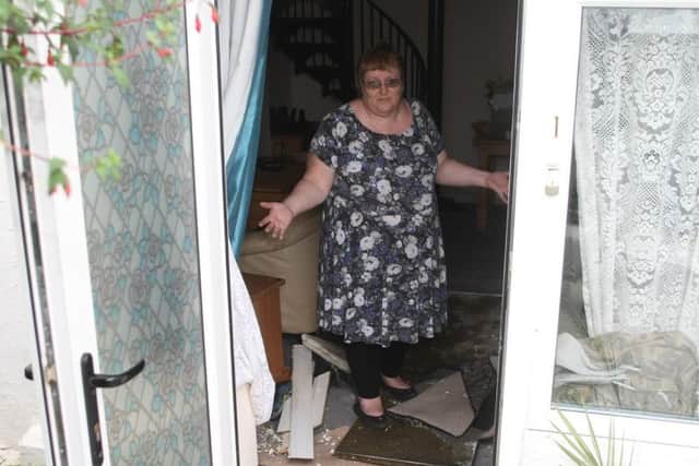 Flooding in Littlehampton - the day after. Theresa Liddy in her badly flooded South Terrace home. Picture: Derek Martin