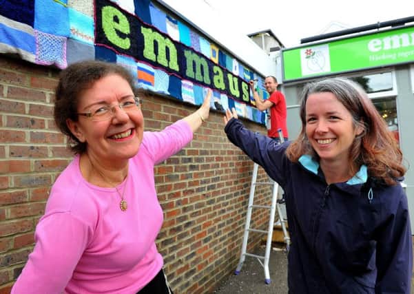 Emily Phillips, director of Over the Moon, right, and Emmaus by the Sea shop manager Jane Davies with the Yarn Trail installation. Picture: Steve Robards SR1815198