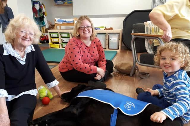 Hardy the labrador chilling out with children and family at Embrace East Sussex