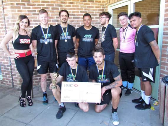 Winning team, Ninja Skrtels, with their trophy SUS-180506-120952001