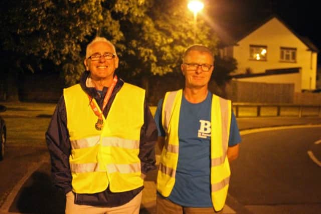 Eddie Betley, left, volunteering for St Barnabas House at Night to Remember in 2017