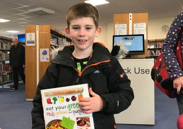 George Downes with his prize at Shoreham Library