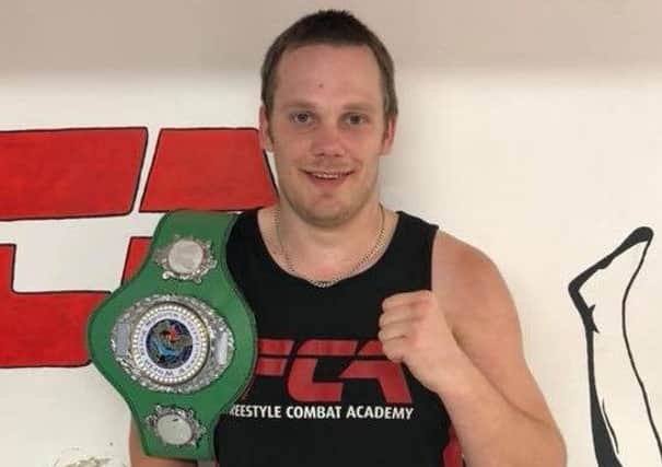 Steve Martin, of Freestyle Combat Academy, with his title belt.