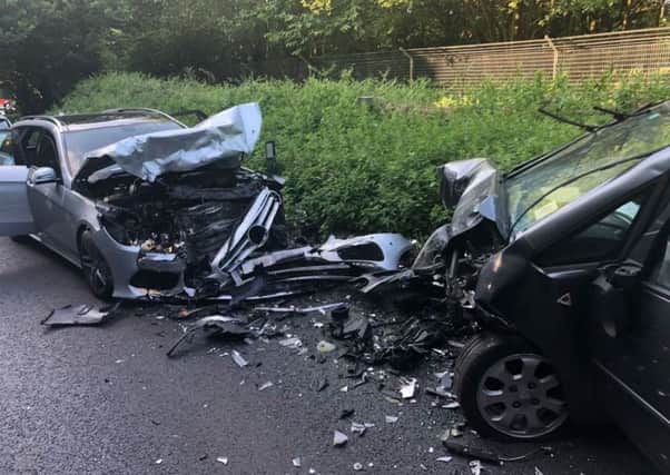 This picture shows the aftermath of Sunday's collision on the A21