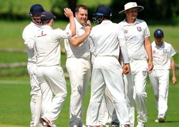 Bexhill celebrate taking a wicket during their heavy defeat at Billingshurst last weekend. Picture by Steve Robards