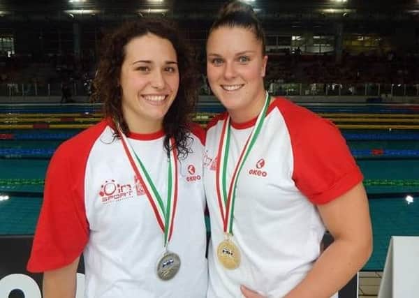 Crawley Town Lifesaving Club star Zara Williams, right, after setting a new European 50m Manikin Carry record with Italian team-mate Alice Marzella who was third SUS-180406-115918002