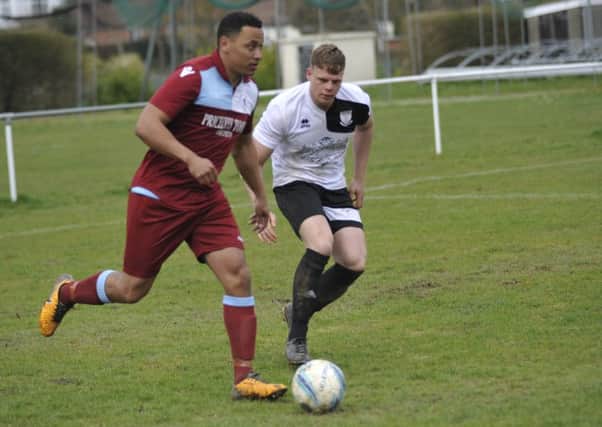 Action from the local derby between Bexhill United and Little Common on Easter Monday. Picture by Simon Newstead