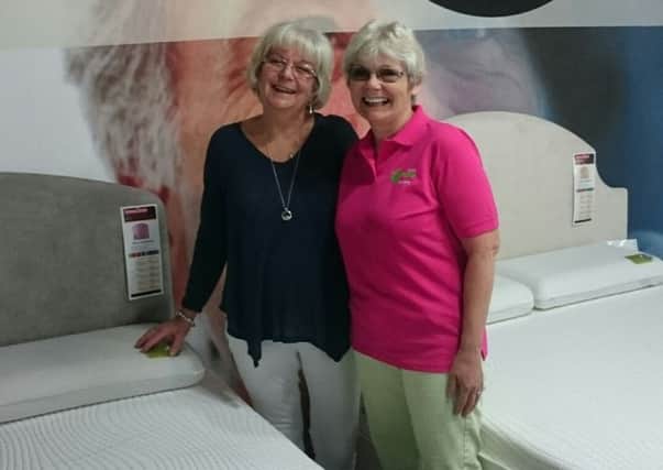 Pauline Heryet and Janet Williamson choosing a new bed