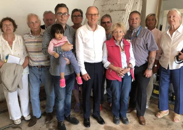 MP Nick Gibb with Wayne McConnell and other residents of South Terrace who were affected by flooding